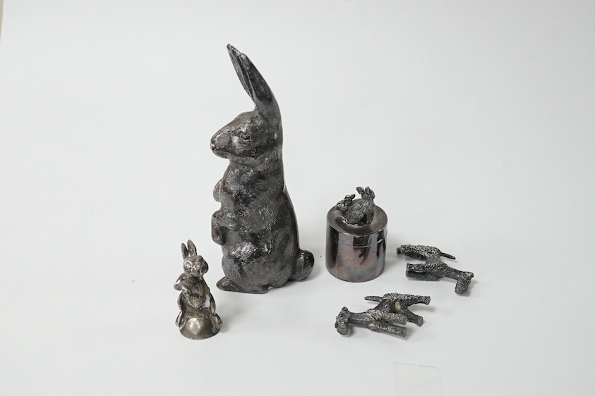 An Elizabeth II silver model of a hare on its haunches, Edward Barnard & Sons, Ltd, London, 1973, 11.8cm, weighted, together with two modern miniature model schnauzers, a modern silver pill box and cover with rabbit surm